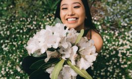 girl smiling with a bouquet of flowers